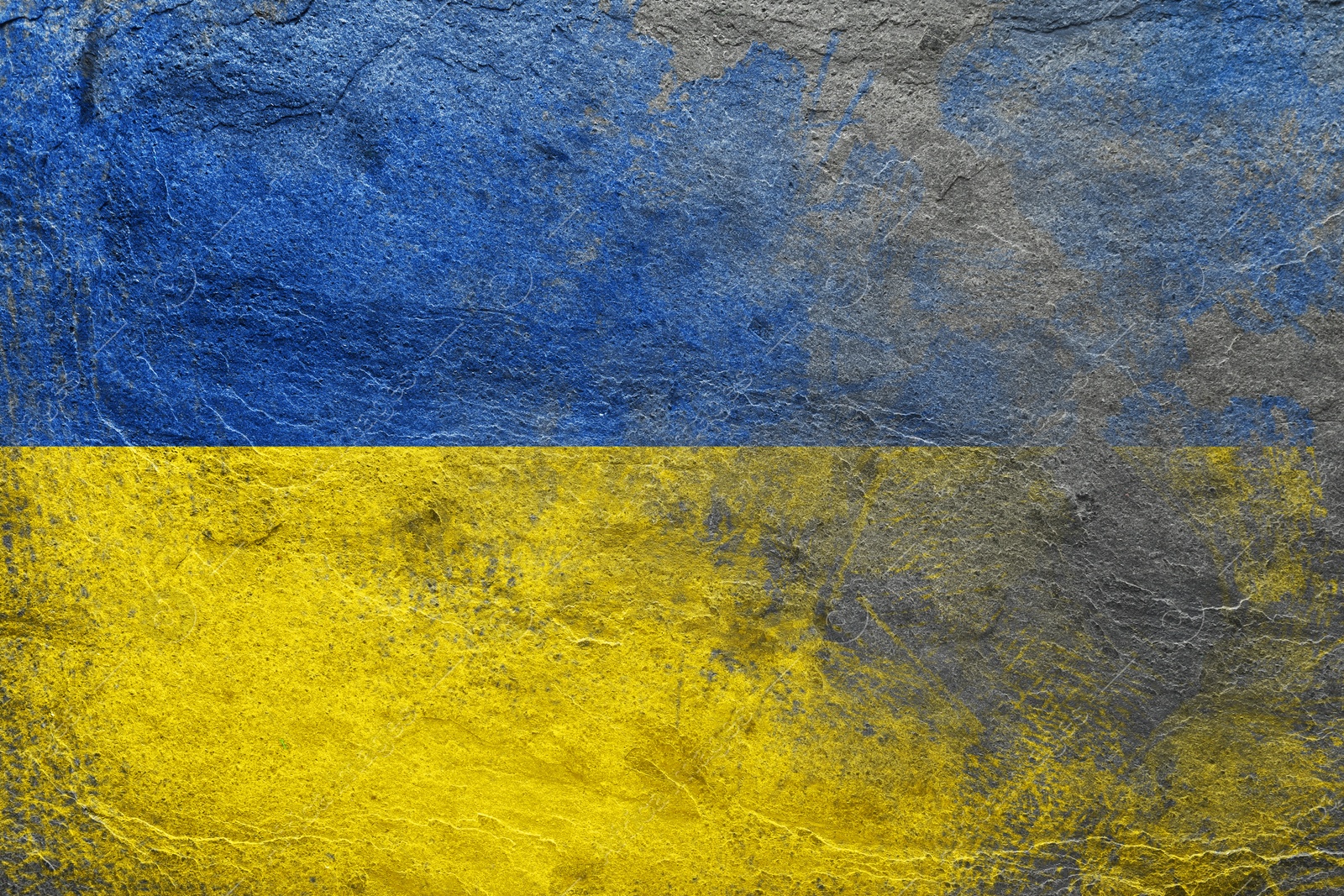 Image of National flag of Ukraine painted on textured surface