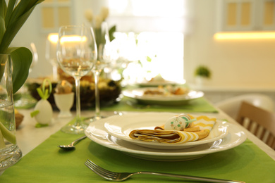 Photo of Beautiful festive Easter table setting with eggs