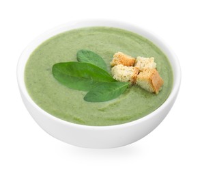 Photo of Delicious spinach cream soup with croutons in bowl isolated on white