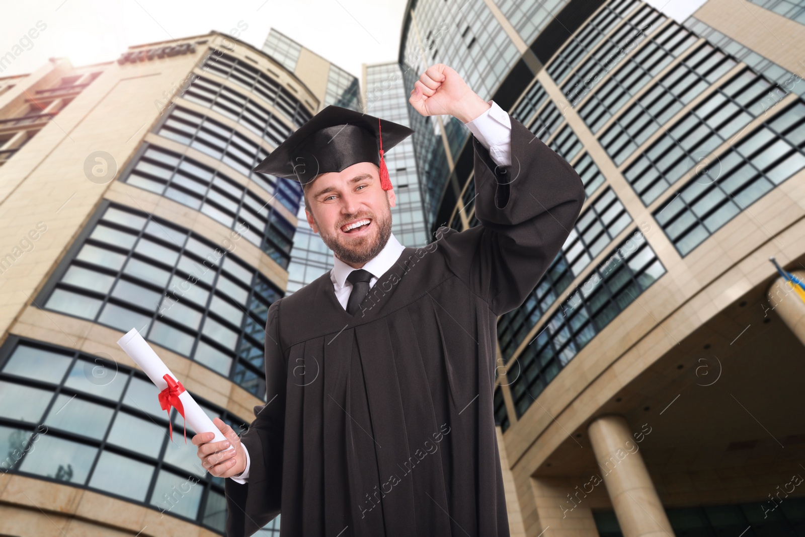 Image of Happy student with graduation hat and diploma outdoors 