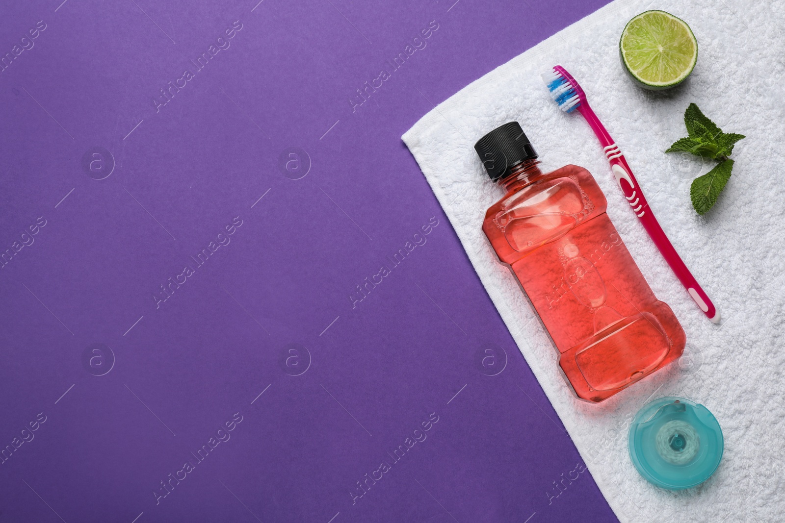 Photo of Composition with mouthwash and other oral hygiene products on purple background, top view. Space for text