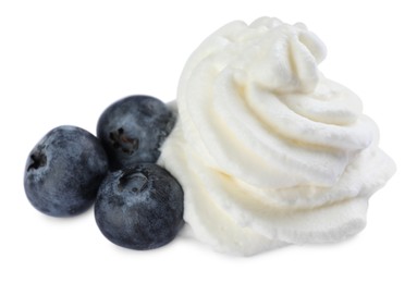 Photo of Delicious fresh whipped cream with blueberries isolated on white