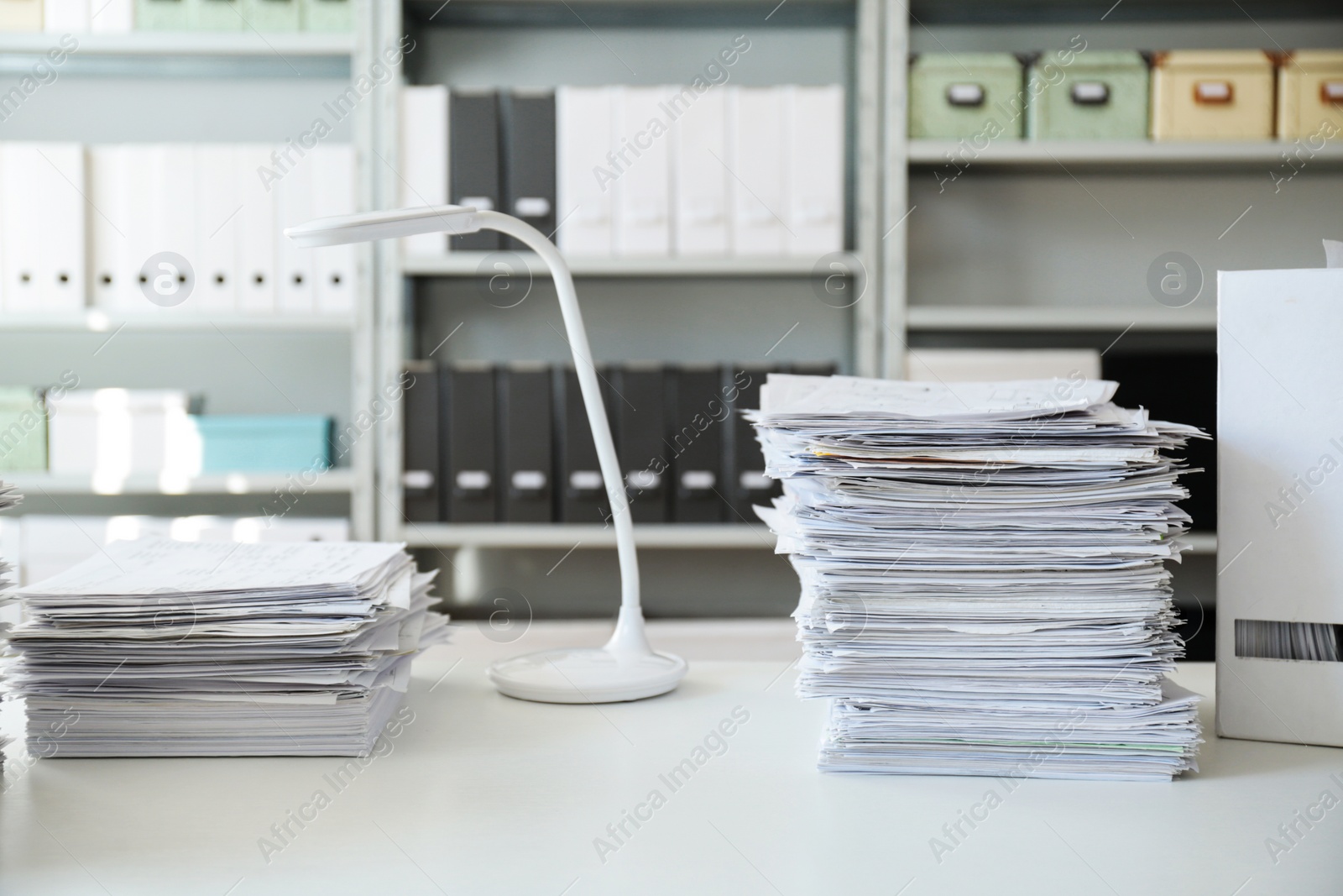 Photo of Stacks of documents on table in office