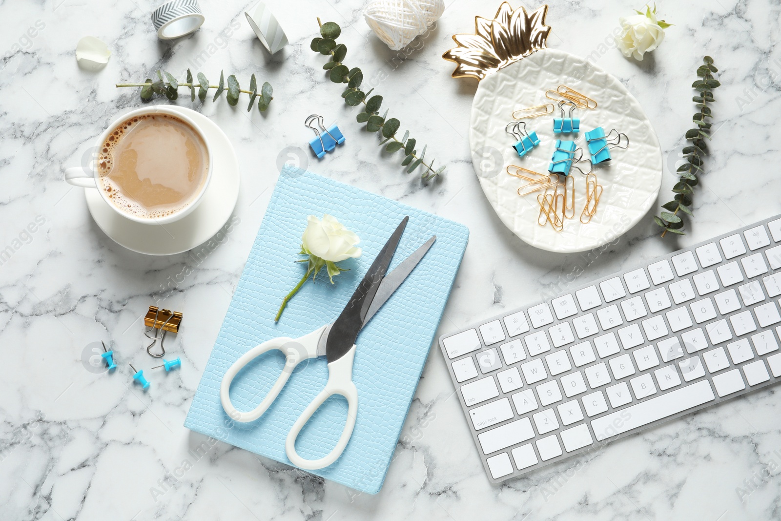 Photo of Flat lay composition with scissors, coffee and keyboard on white marble table