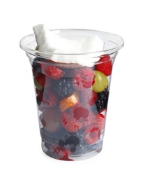 Photo of Fresh tasty fruit salad in plastic cup on white background