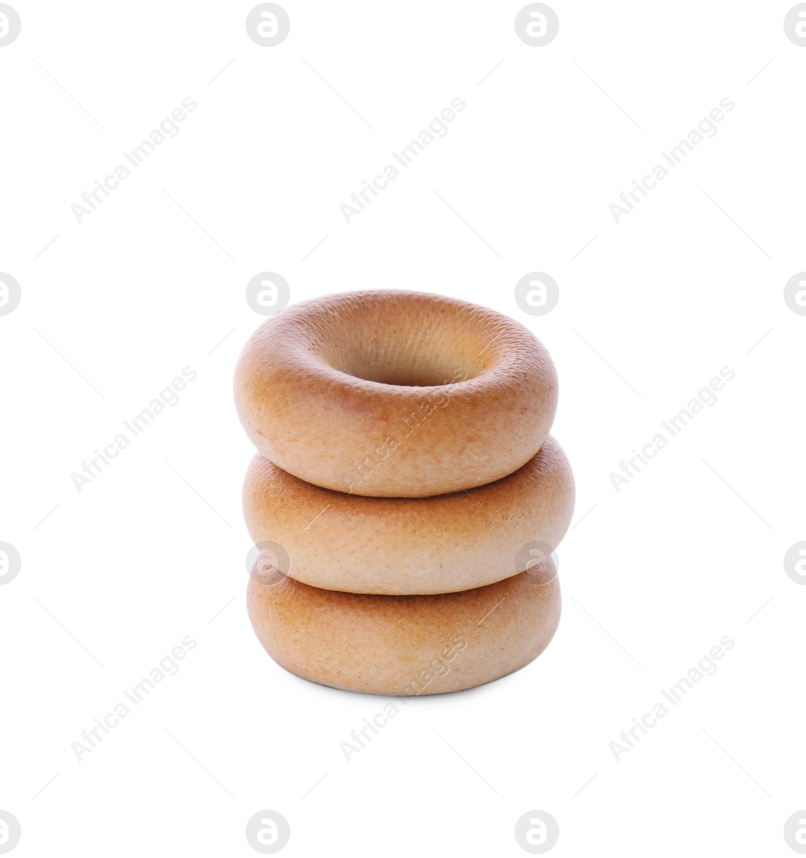 Photo of Stack of tasty dry bagels (sushki) on white background