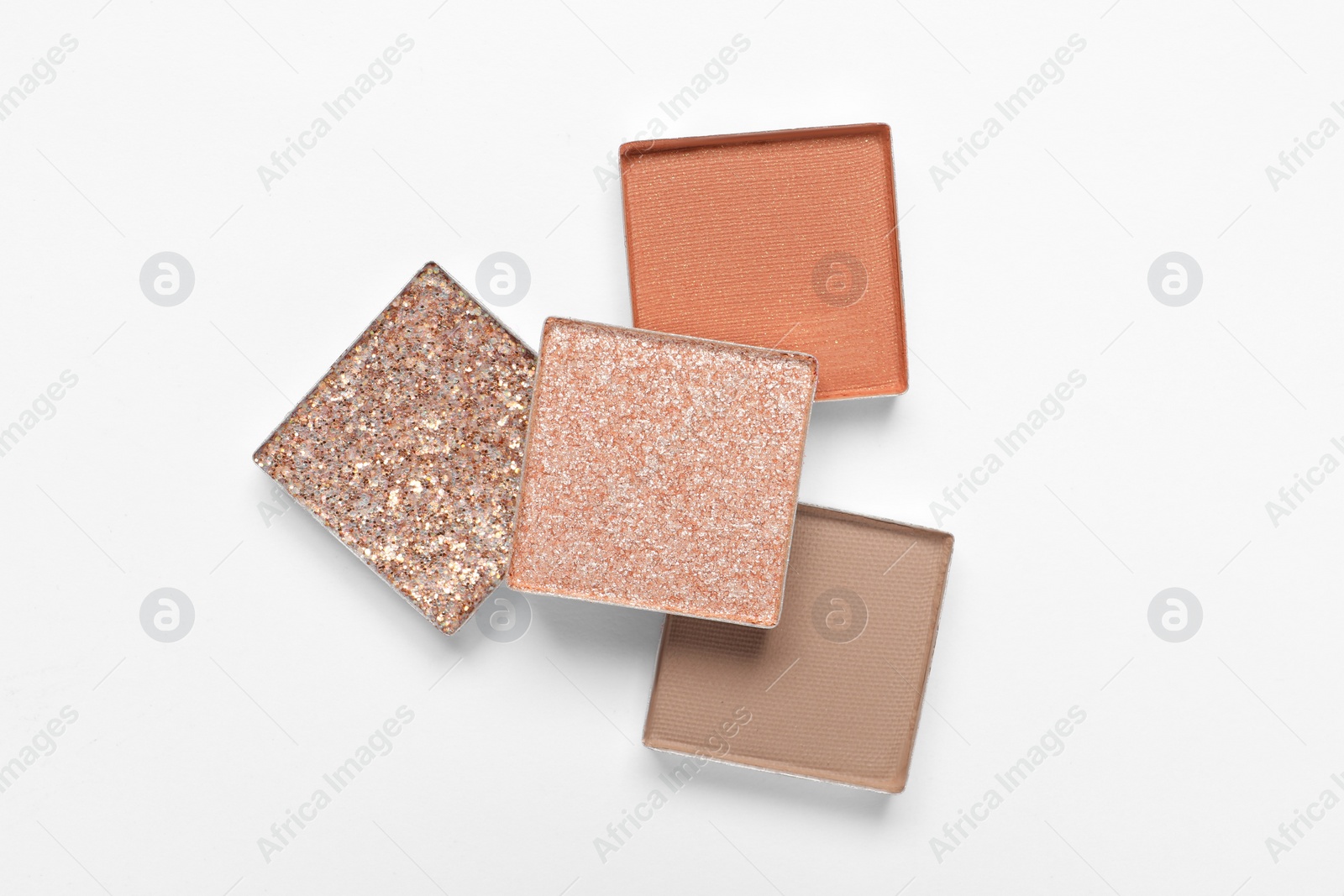 Photo of Different beautiful eye shadows on white background, flat lay