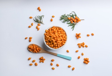 Fresh ripe sea buckthorn on white background, flat lay