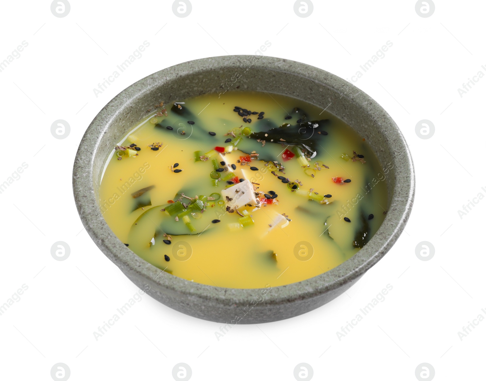 Photo of Bowl of delicious miso soup with tofu isolated on white