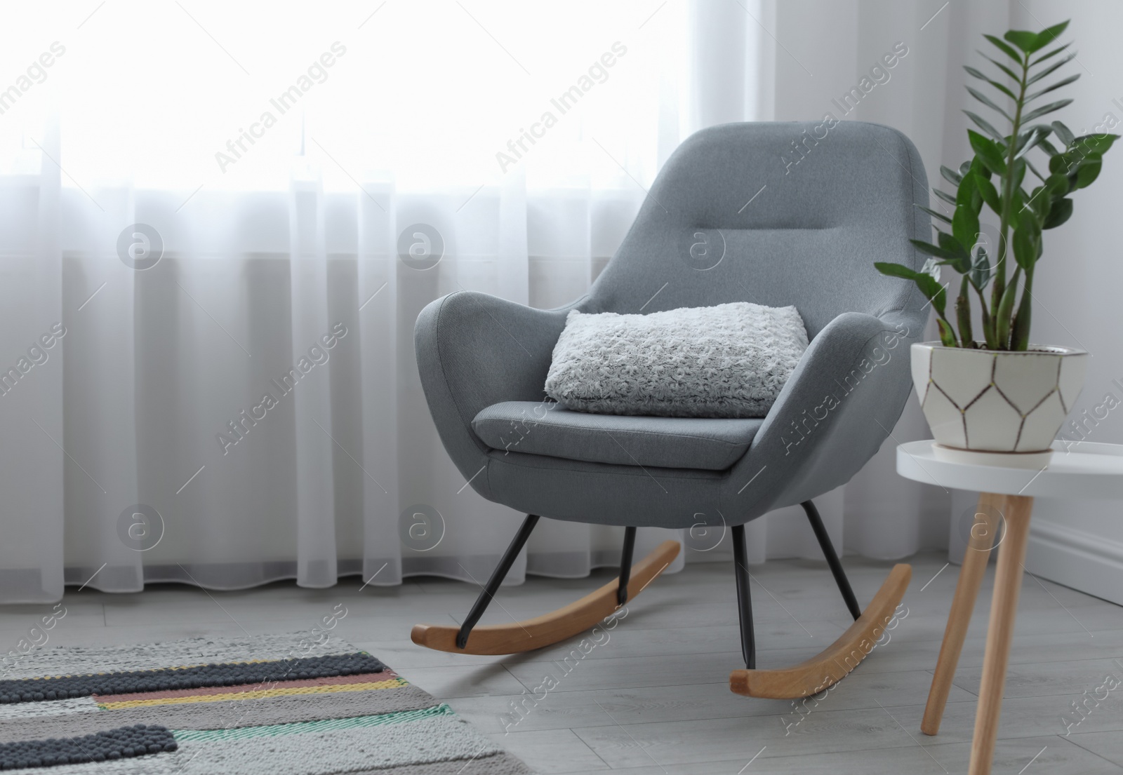 Photo of Elegant living room interior with rocking chair