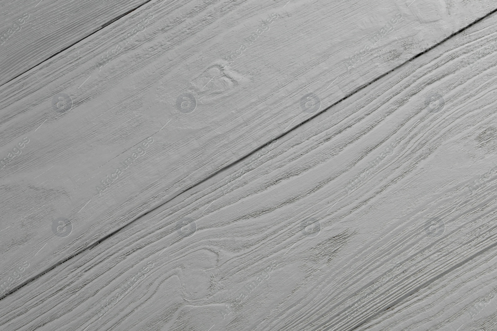 Photo of Texture of light grey wooden surface as background, closeup