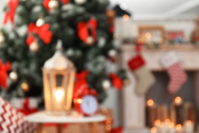 Photo of Blurred view of stylish living room interior with decorated Christmas tree