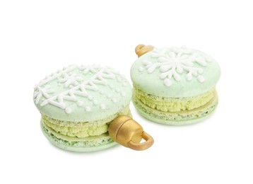 Photo of Beautifully decorated Christmas macarons on white background