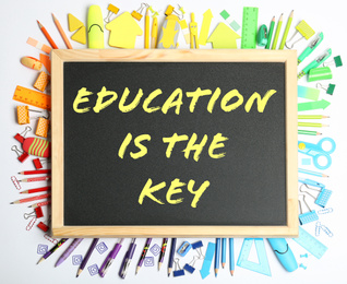 Image of Different school stationery and small chalkboard with phrase EDUCATION IS THE KEY on white background, top view. Adult learning