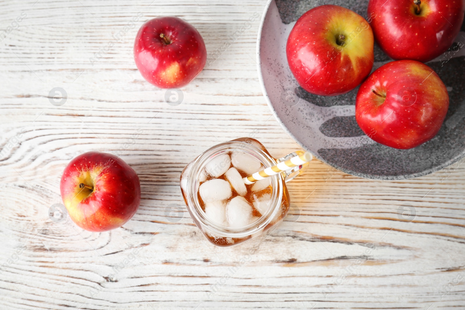 Photo of Composition with fresh apple juice on wooden table, top view