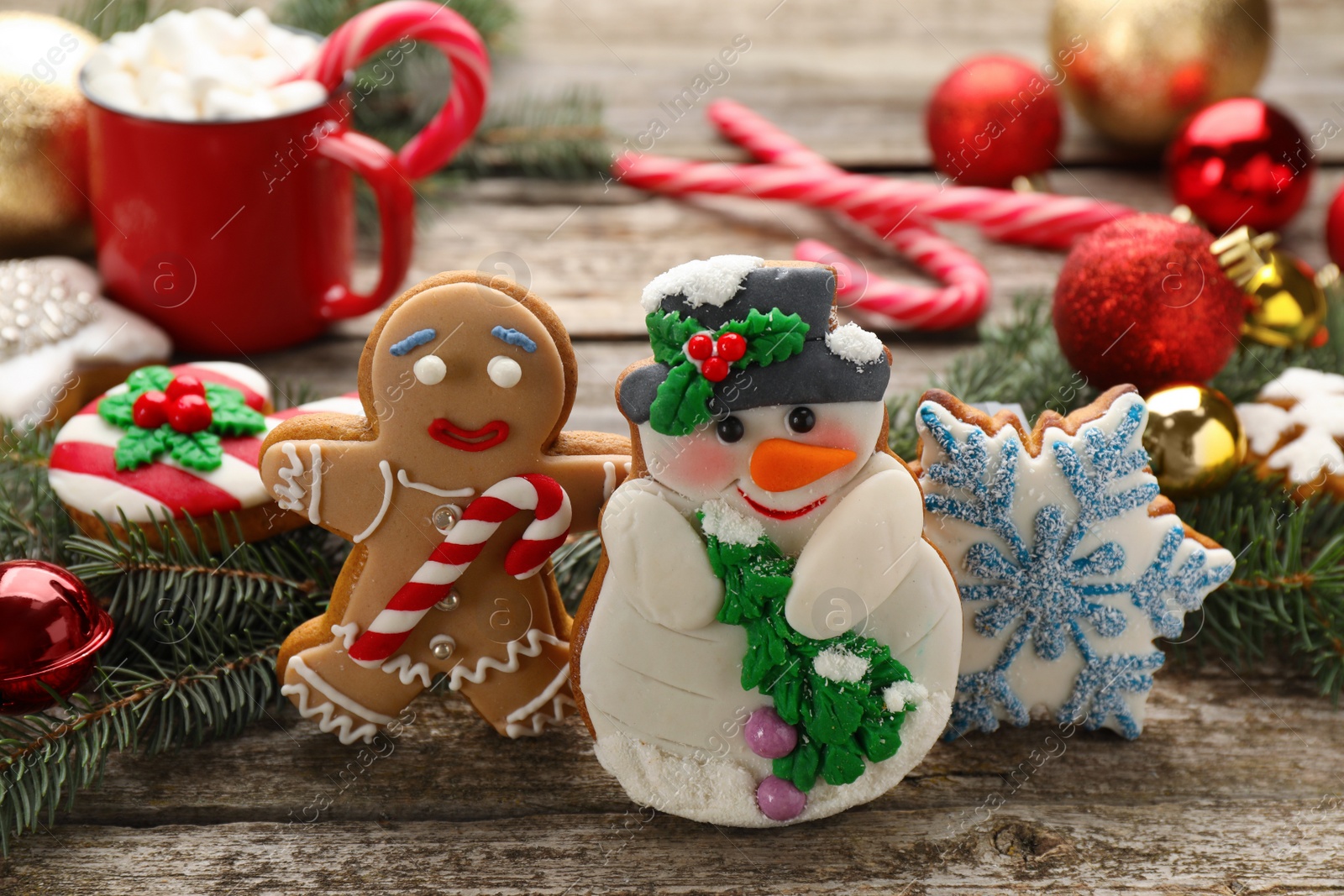 Photo of Delicious homemade Christmas cookies and festive decor on wooden table