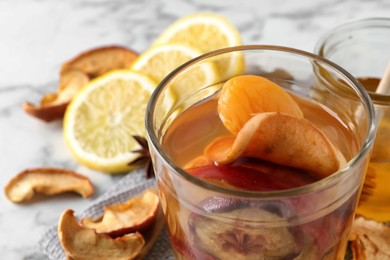 Photo of Delicious compote with dried fruits in glass on table, closeup. Space for text