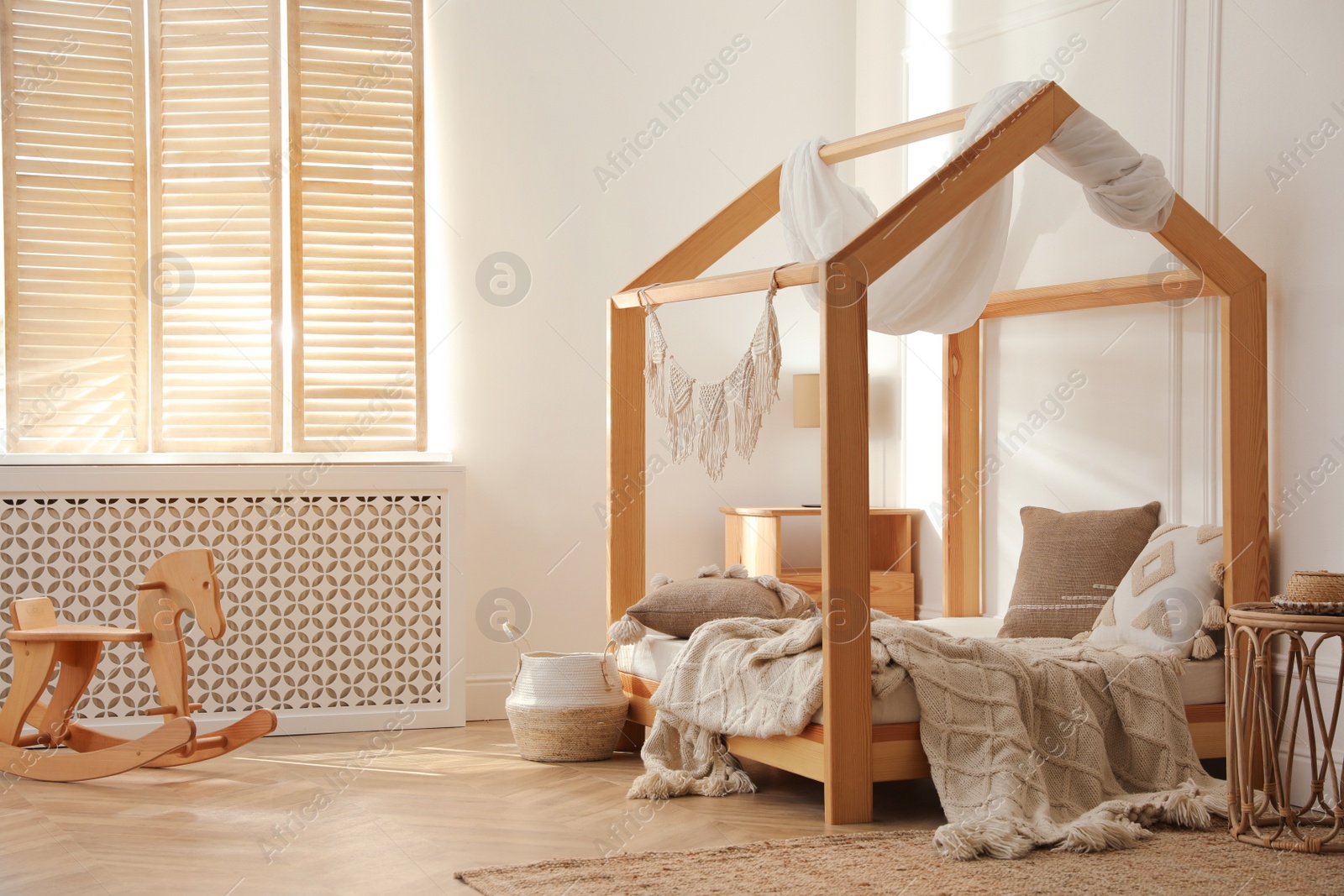 Photo of Stylish child room interior with house bed