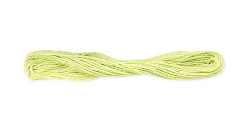 Photo of Bright yellowish green embroidery thread on white background