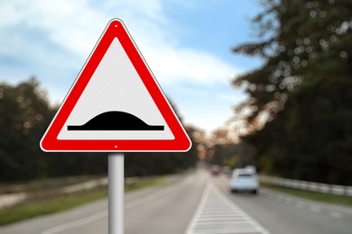 Sign Speed Bump near asphalt road outdoors 