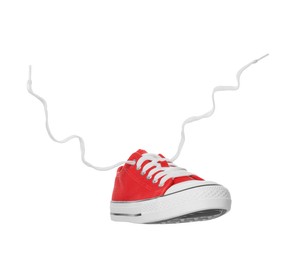 Photo of Red classic old school sneaker isolated on white