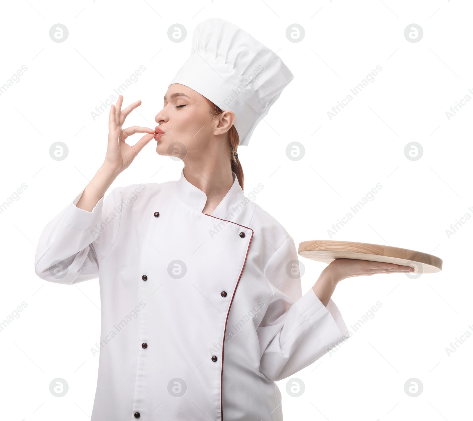 Photo of Happy chef in uniform holding empty wooden board and showing perfect sign on white background