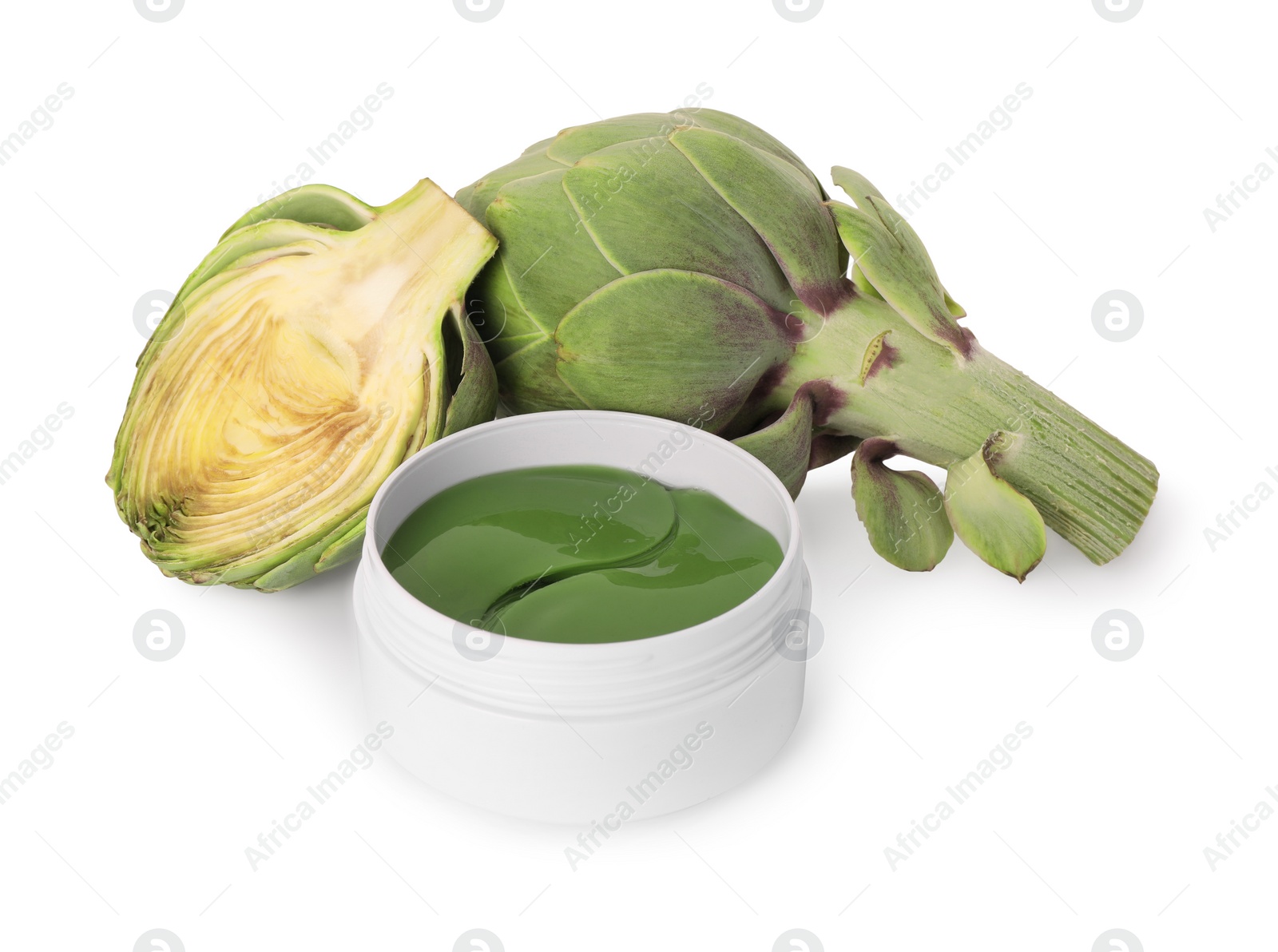 Photo of Package of under eye patches and artichokes on white background. Cosmetic product