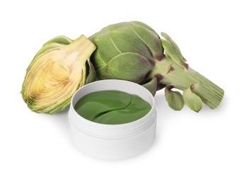 Photo of Package of under eye patches and artichokes on white background. Cosmetic product