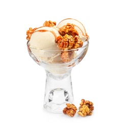 Photo of Delicious ice cream with caramel popcorn and sauce in glass dessert bowl on white background