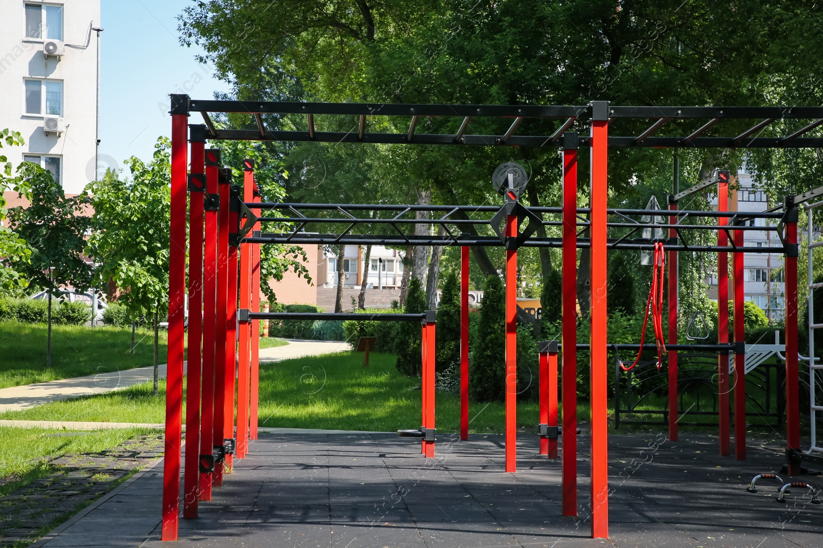 Photo of Empty outdoor gym with exercise equipment in park