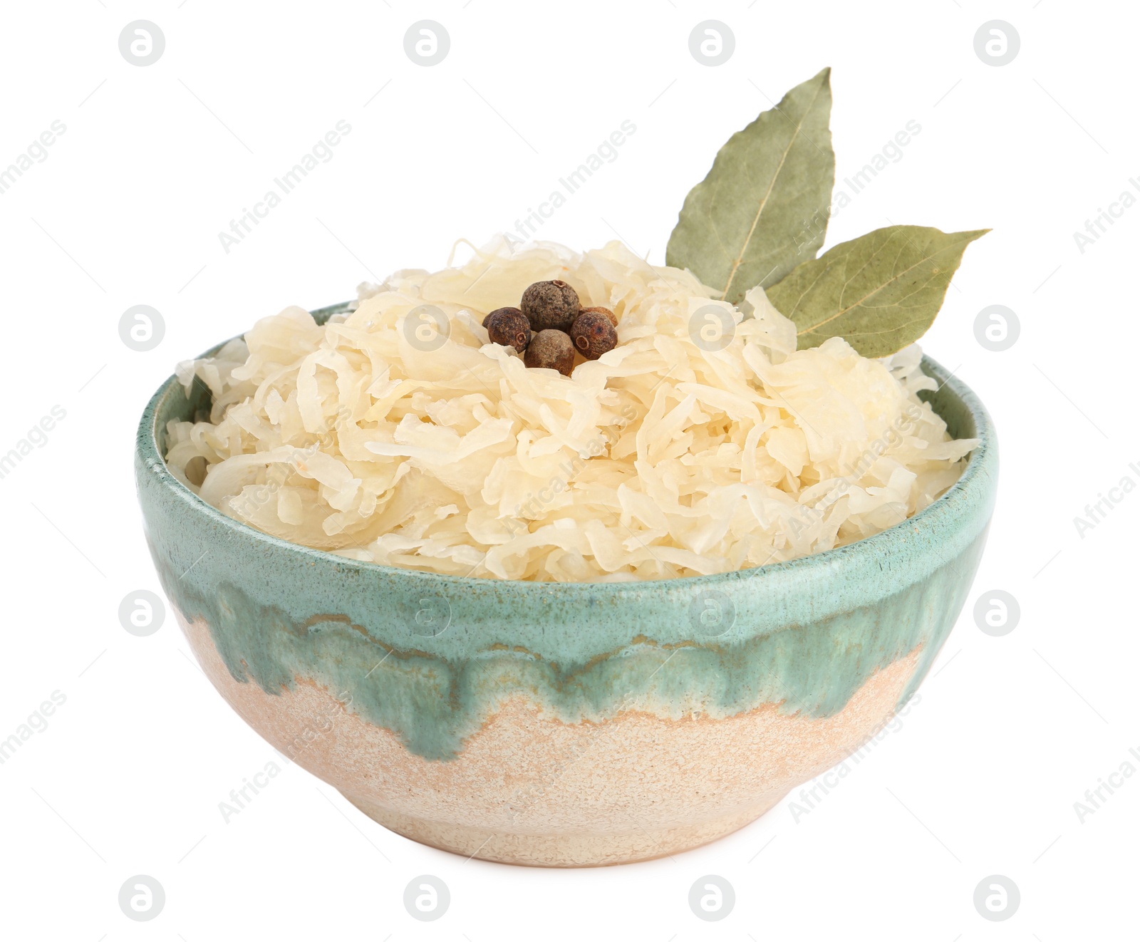 Photo of Bowl of tasty sauerkraut with peppercorns and bay leaves on white background