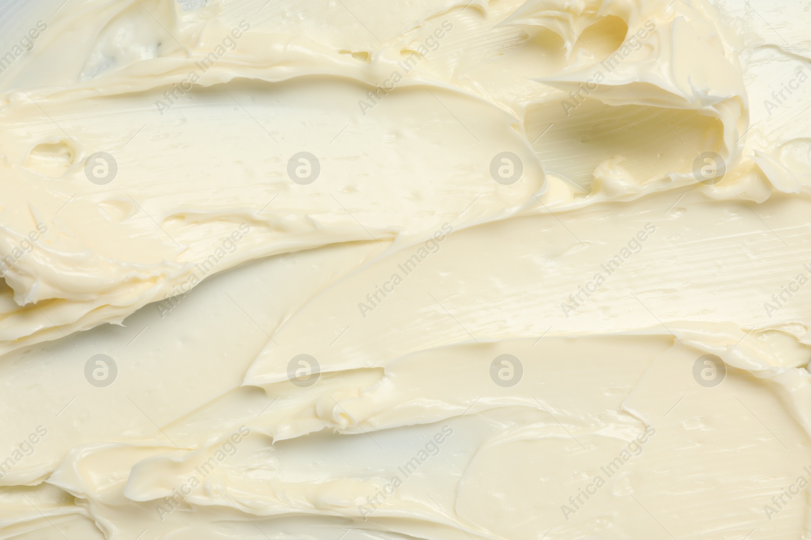 Photo of Texture of tasty butter as background, top view