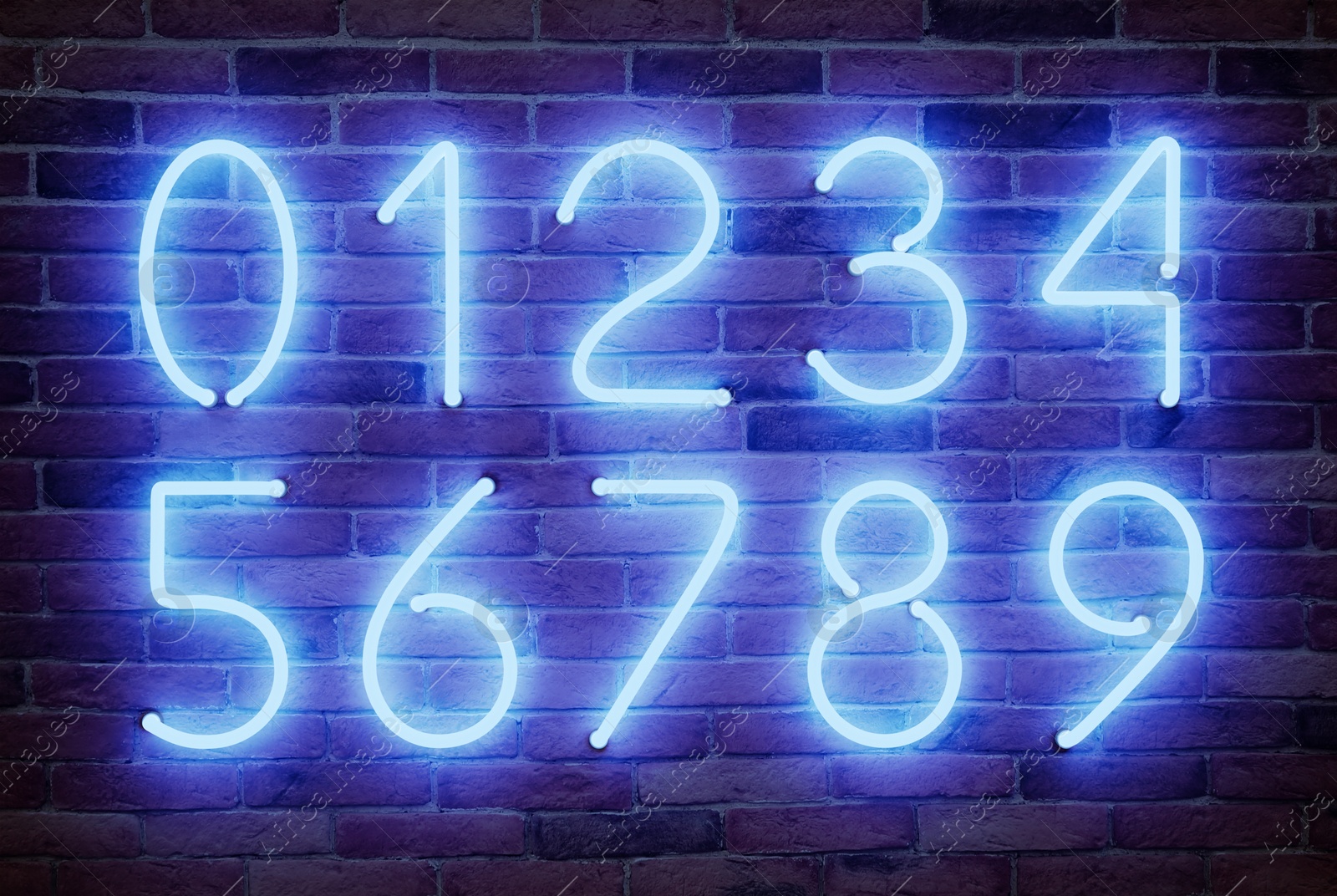 Image of Glowing neon number signs on brick wall