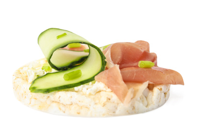 Photo of Puffed rice cake with prosciutto and cucumber isolated on white