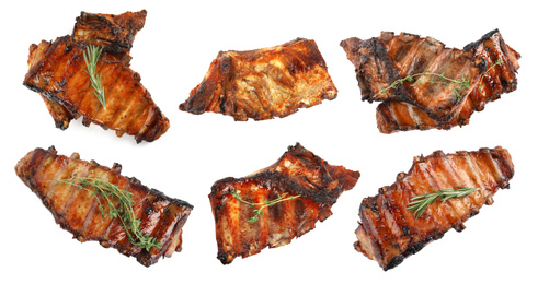 Set of delicious roasted ribs on white background, top view