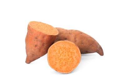 Photo of Whole and cut ripe sweet potatoes on white background