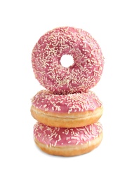 Delicious glazed doughnuts with sprinkles on white background