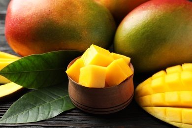 Photo of Composition with fresh mango on table, closeup