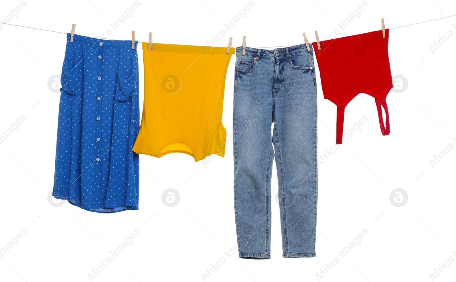 Photo of Different clothes drying on laundry line against white background