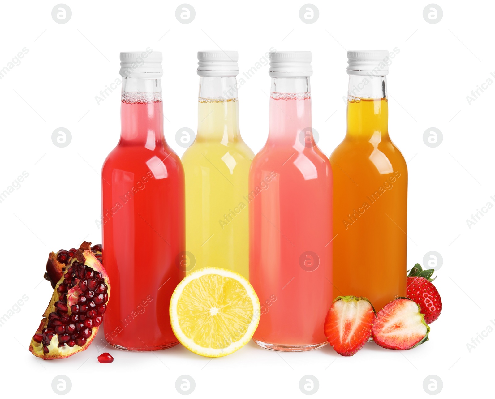 Photo of Delicious kombucha in glass bottles and fresh fruits isolated on white