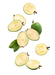 Fresh feijoa fruits and leaves falling on white background