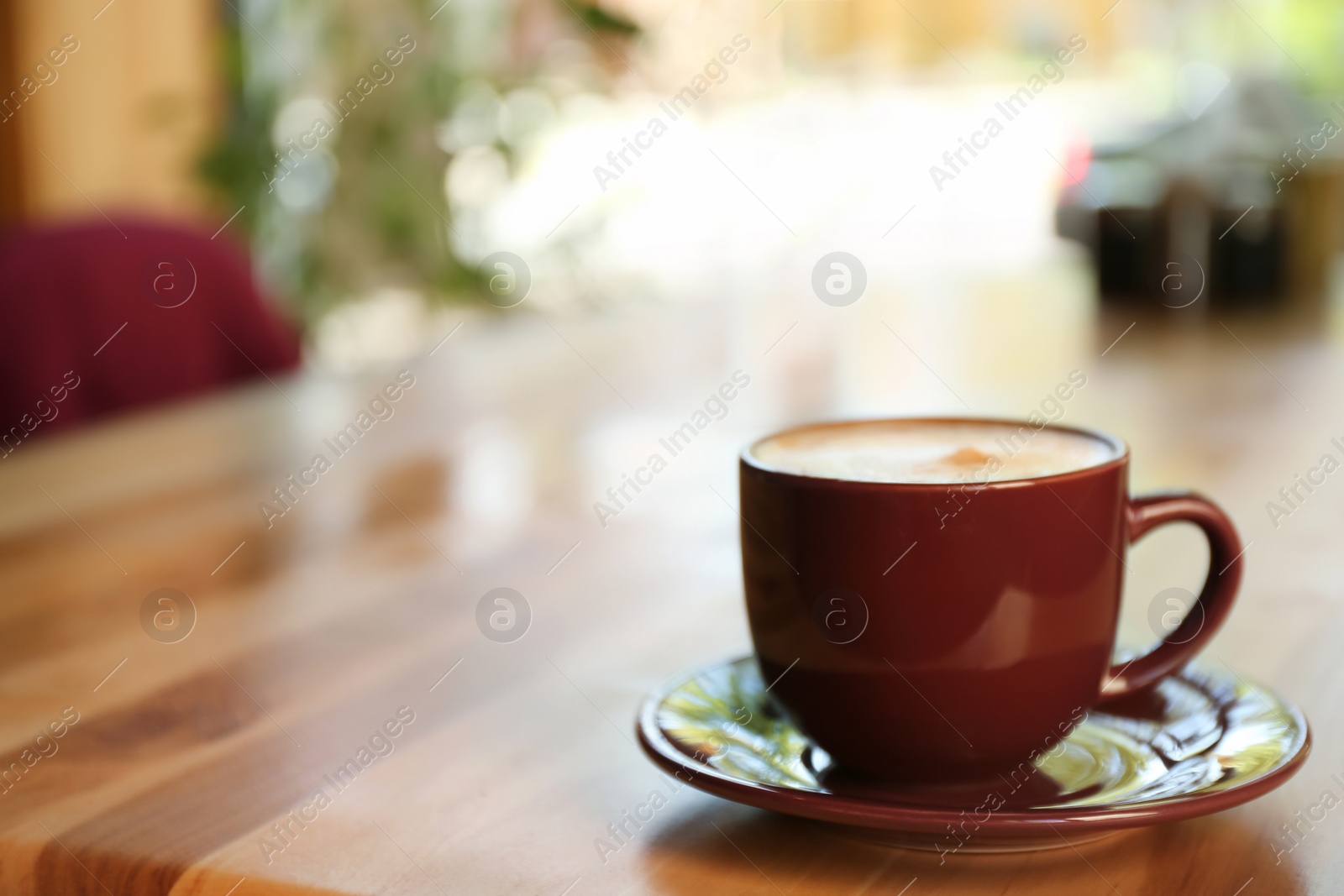 Photo of Aromatic coffee on wooden table in cafe. Space for text