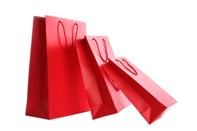 Red paper shopping bags isolated on white