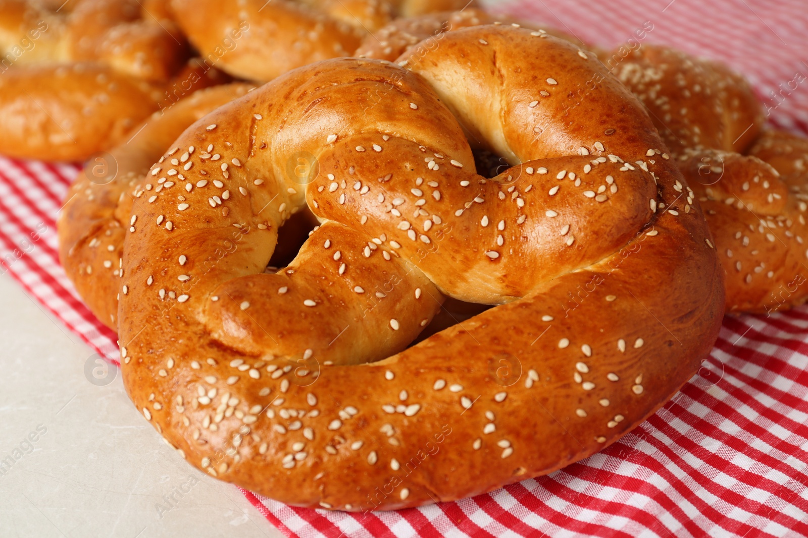 Photo of Tasty freshly baked pretzels on table, closeup