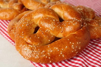 Photo of Tasty freshly baked pretzels on table, closeup