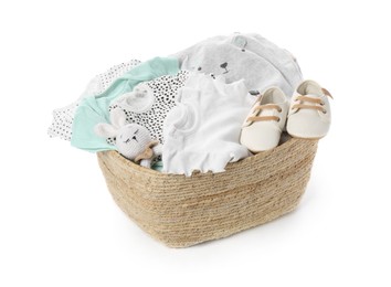 Laundry basket with baby clothes, shoes and toy isolated on white