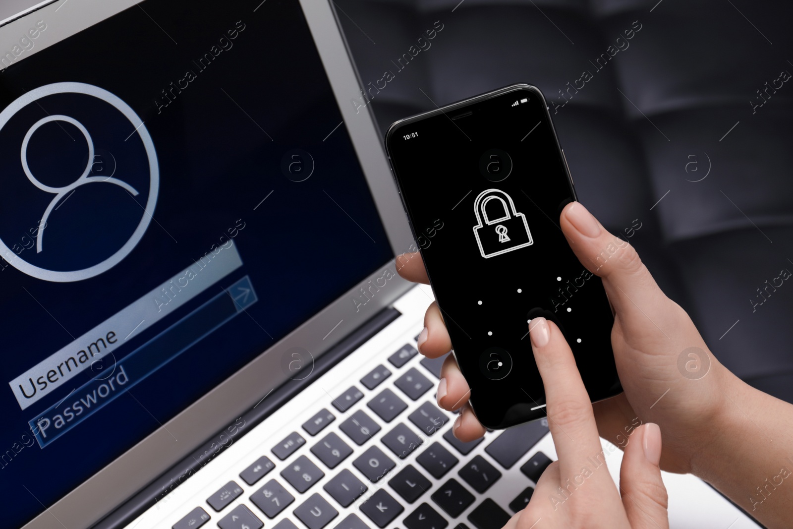 Photo of Woman unlocking smartphone with blocked screen near laptop indoors, closeup