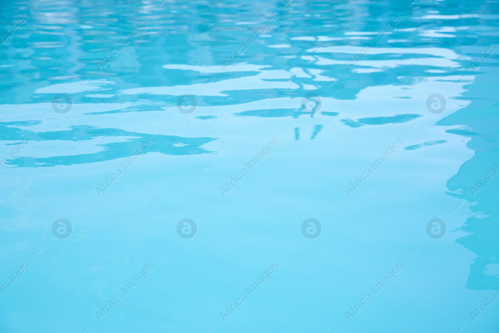 Photo of Clear water in swimming pool as background, closeup