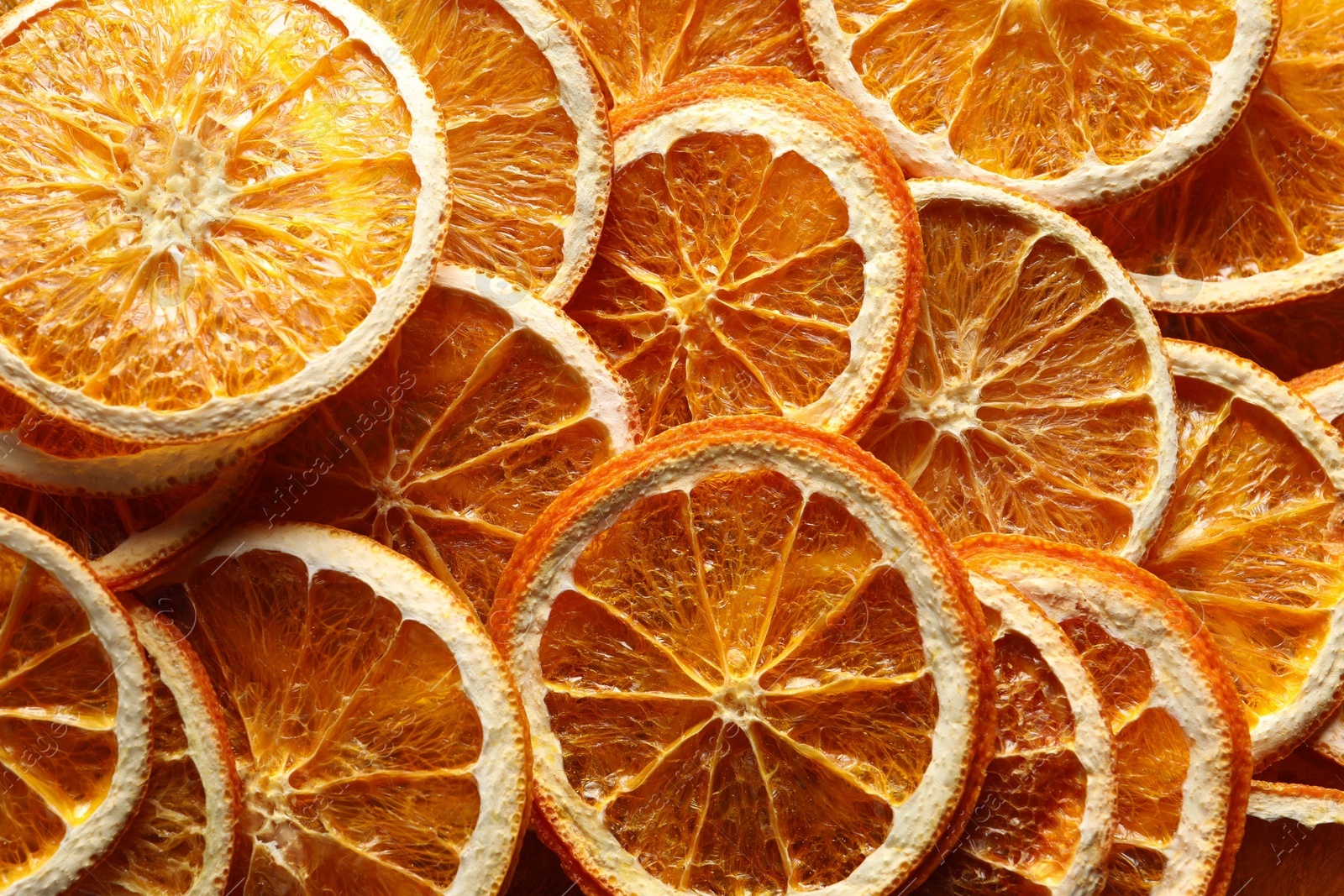 Photo of Many dry orange slices as background, top view