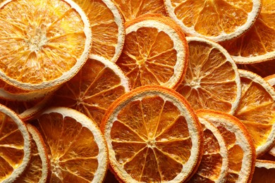 Photo of Many dry orange slices as background, top view